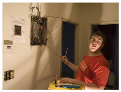 Student replacing electrical system