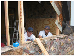 Students replacing damaged exterior walls